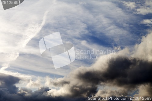 Image of Sunny sky with dark clouds