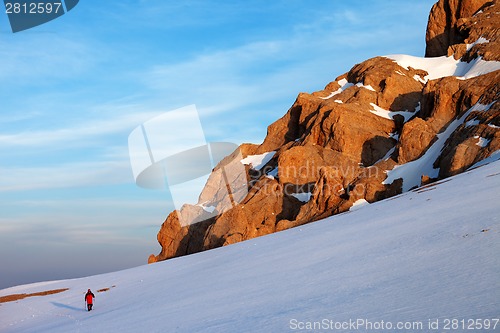 Image of Hiker at sunrise mountains