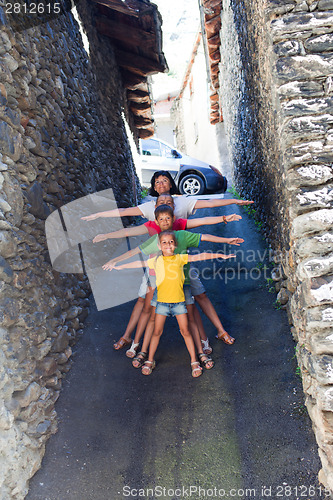 Image of Funny family on narrow street