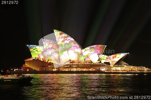 Image of  Sydney Opera House covered in masses of flowers during Vivid Sy