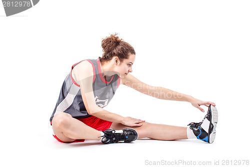 Image of Basketball woman stretching leg