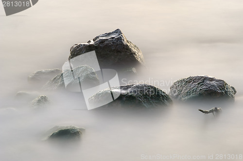 Image of Wet stones in the lake. 