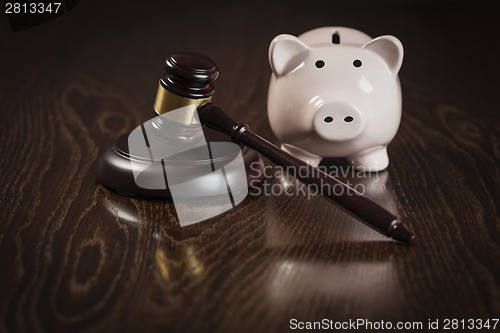 Image of Gavel and Piggy Bank on Table