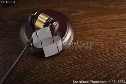 Image of Wooden Gavel Abstract on Table