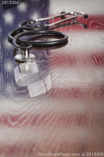 Image of Stethoscope with American Flag Reflection on Table