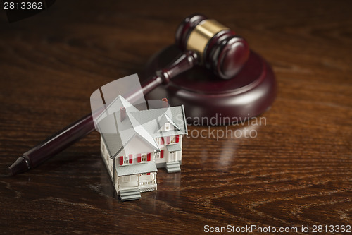 Image of Gavel and Small Model House on Table