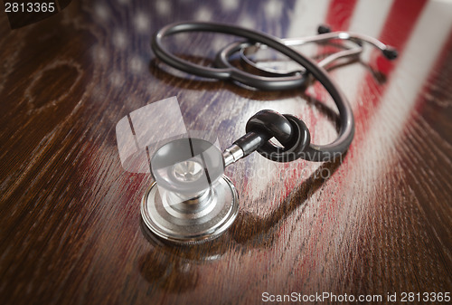Image of Knotted Stethoscope with American Flag Reflection on Table