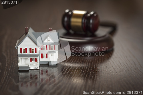 Image of Gavel and Small Model House on Table