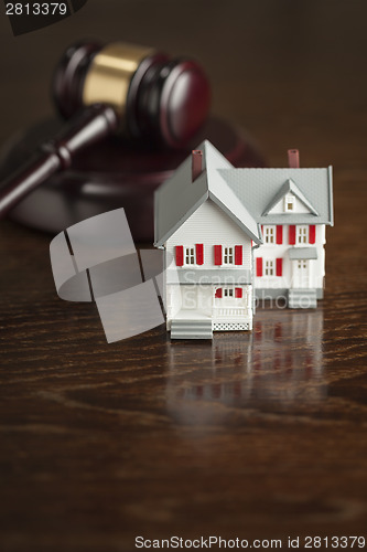 Image of Gavel and Small Model House on Table