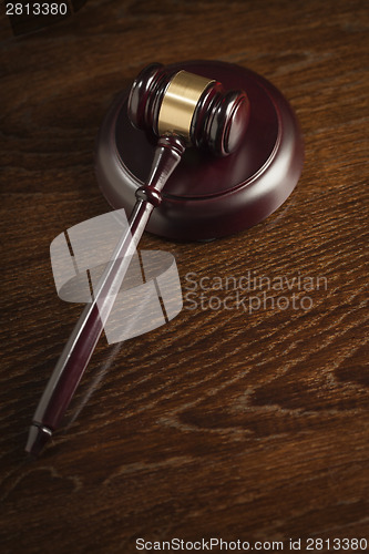 Image of Wooden Gavel Abstract on Table