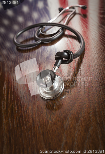 Image of Knotted Stethoscope with American Flag Reflection on Table