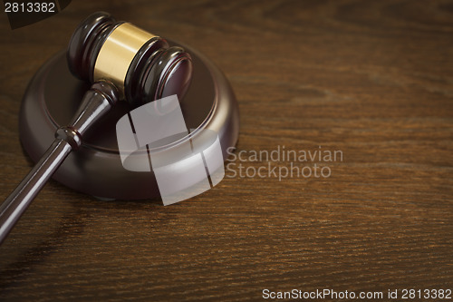 Image of Wooden Gavel Abstract on Table