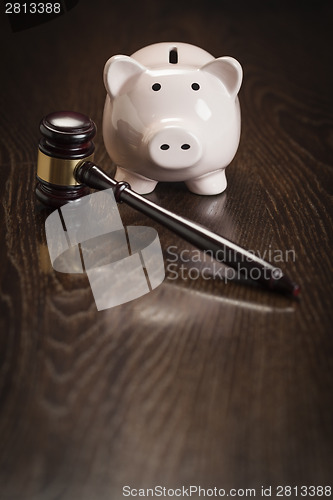 Image of Gavel and Piggy Bank on Table