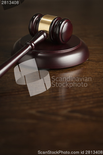 Image of Wooden Gavel Abstract on Table