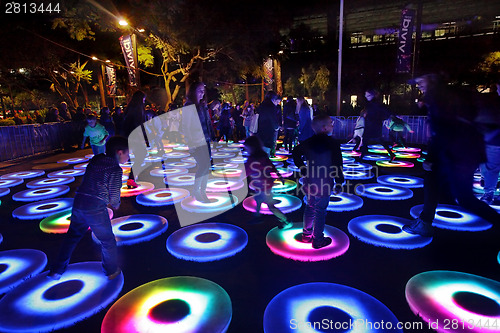 Image of Participants interact with Vivid Sydney The Pool interactive cir