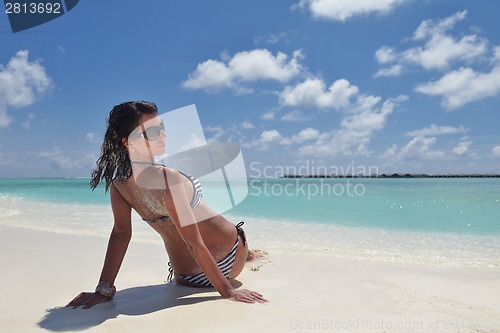 Image of beautiful young woman  on beach have fun and relax
