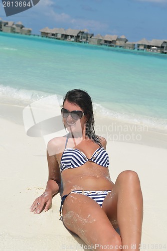 Image of beautiful young woman  on beach have fun and relax