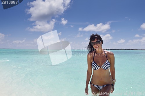 Image of beautiful young woman  on beach have fun and relax