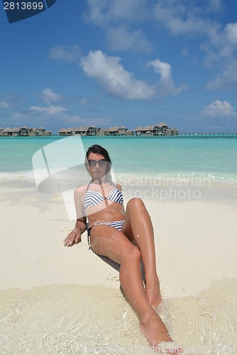 Image of beautiful young woman  on beach have fun and relax