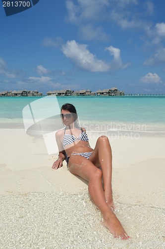 Image of beautiful young woman  on beach have fun and relax