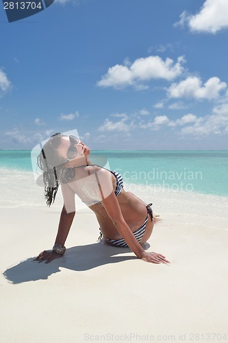 Image of beautiful young woman  on beach have fun and relax