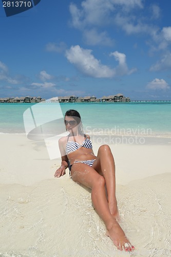 Image of beautiful young woman  on beach have fun and relax
