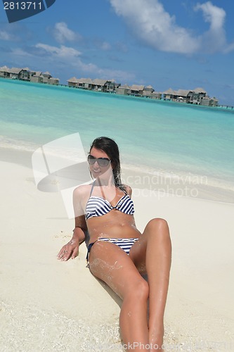 Image of beautiful young woman  on beach have fun and relax