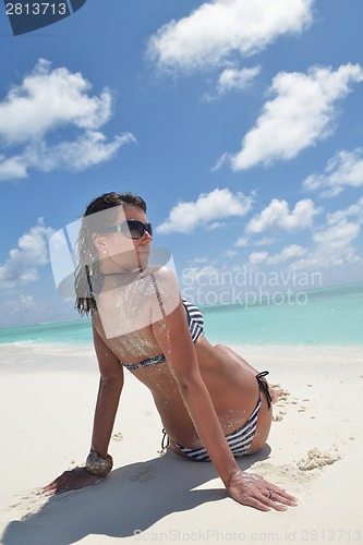 Image of beautiful young woman  on beach have fun and relax