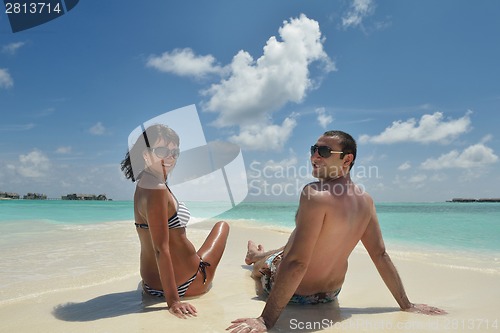 Image of happy young couple have fun on beach