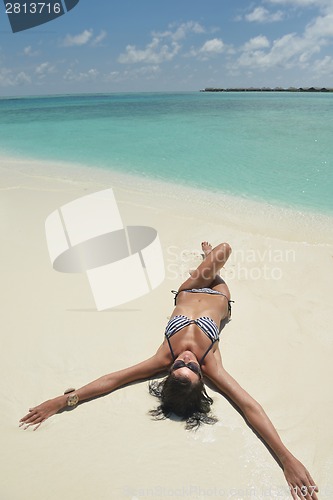 Image of beautiful young woman  on beach have fun and relax