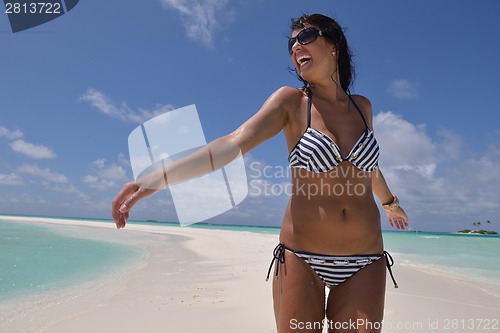 Image of beautiful young woman  on beach have fun and relax