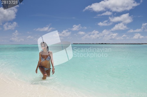 Image of beautiful young woman  on beach have fun and relax