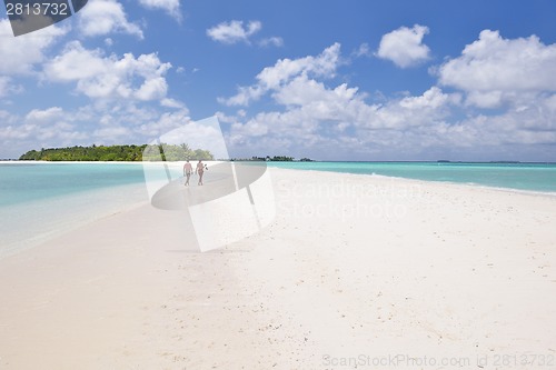 Image of happy young couple have fun on beach
