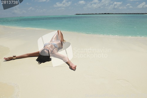 Image of beautiful young woman  on beach have fun and relax