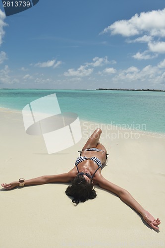 Image of beautiful young woman  on beach have fun and relax