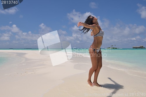 Image of beautiful young woman  on beach have fun and relax