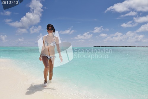 Image of beautiful young woman  on beach have fun and relax