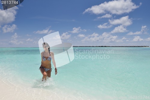 Image of beautiful young woman  on beach have fun and relax
