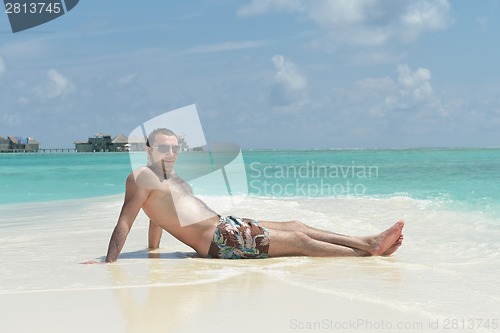 Image of beautiful young woman  on beach have fun and relax