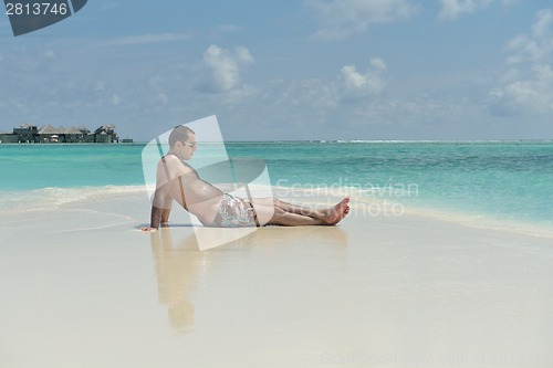 Image of beautiful young woman  on beach have fun and relax