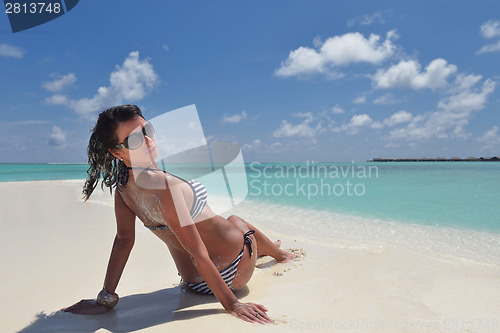 Image of beautiful young woman  on beach have fun and relax