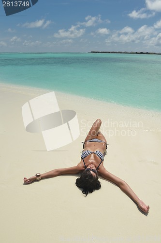 Image of beautiful young woman  on beach have fun and relax