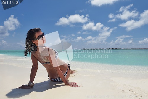 Image of beautiful young woman  on beach have fun and relax