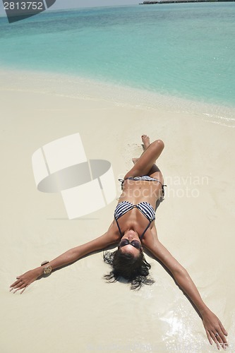 Image of beautiful young woman  on beach have fun and relax