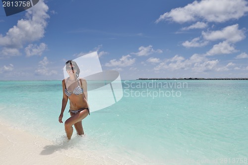 Image of beautiful young woman  on beach have fun and relax