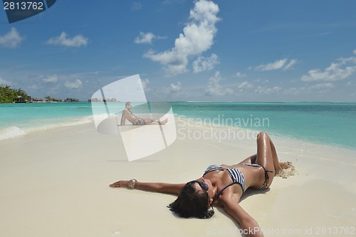 Image of happy young couple have fun on beach