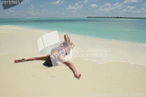 Image of beautiful young woman  on beach have fun and relax
