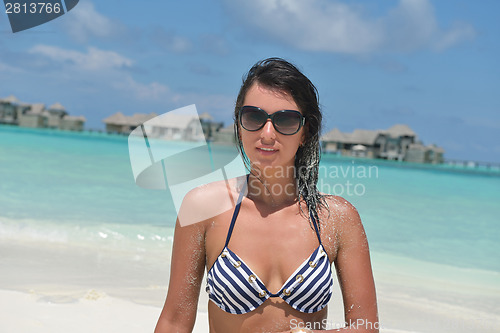 Image of beautiful young woman  on beach have fun and relax