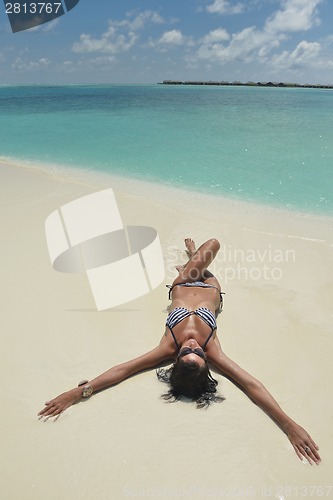 Image of beautiful young woman  on beach have fun and relax