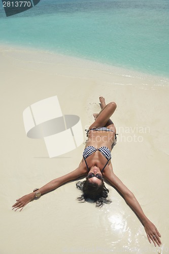 Image of beautiful young woman  on beach have fun and relax